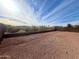 Large backyard with gravel and a view of trees at 17545 W Canyon Ln, Goodyear, AZ 85338