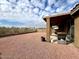 Large backyard with desert landscaping and a covered patio, perfect for outdoor entertaining at 17545 W Canyon Ln, Goodyear, AZ 85338
