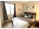 Bright bedroom with double bed and window at 17545 W Canyon Ln, Goodyear, AZ 85338