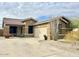 Single-story house with a two-car garage and desert landscaping at 17545 W Canyon Ln, Goodyear, AZ 85338