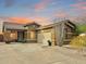 Charming single-story home features desert landscaping, a neutral color scheme, and a two car garage at 17545 W Canyon Ln, Goodyear, AZ 85338