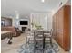 Dining area with gray chairs, wood cabinets, and view of living room at 2021 E Orion St, Tempe, AZ 85283