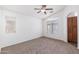 Bright bedroom with carpet flooring, ceiling fan, and large windows at 2150 E Bell Rd # 1045, Phoenix, AZ 85022