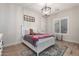 Charming bedroom with a plush rug, white furniture, a teddy bear and a large window at 25516 S 205Th Way, Queen Creek, AZ 85142