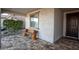 Front porch with a carved wooden bench and tile flooring at 25921 W Kimberly Way, Buckeye, AZ 85396