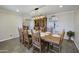 Large dining room with a rustic wooden table and chairs at 260 E Estero Ln, Litchfield Park, AZ 85340