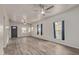 Bright living room with hardwood floors and ceiling fan at 305 W 9Th St, Casa Grande, AZ 85122