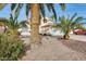 Two-story house with a two-car garage, palm trees, and gravel landscaping at 3118 N 114Th Dr, Avondale, AZ 85392