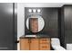 Modern bathroom with floating vanity, large mirror and walk in shower at 3807 N 55Th Pl, Phoenix, AZ 85018