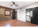 Spacious bedroom with exposed brick wall and terracotta tile floor at 3807 N 55Th Pl, Phoenix, AZ 85018