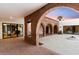 Charming courtyard with brick arches and a fire pit at 3807 N 55Th Pl, Phoenix, AZ 85018