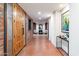 Inviting entryway with wood door, exposed brick, and tile flooring at 3807 N 55Th Pl, Phoenix, AZ 85018