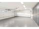Spacious garage with epoxy floor and overhead storage at 3807 N 55Th Pl, Phoenix, AZ 85018