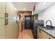 Bright laundry room with ample storage and modern sink at 3807 N 55Th Pl, Phoenix, AZ 85018
