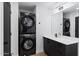 Stackable washer and dryer in a well-lit laundry room at 3807 N 55Th Pl, Phoenix, AZ 85018