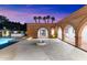 Brick patio with fire pit and arched walkways at 3807 N 55Th Pl, Phoenix, AZ 85018