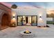 Outdoor patio with fire pit and view into home's interior at 3807 N 55Th Pl, Phoenix, AZ 85018