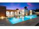Expansive pool and spa with brick accents at dusk at 3807 N 55Th Pl, Phoenix, AZ 85018
