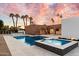 Resort-style backyard oasis with pool, spa, and putting green at 3807 N 55Th Pl, Phoenix, AZ 85018