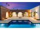 Luxury pool and spa with brick archways and fire pit at 3807 N 55Th Pl, Phoenix, AZ 85018