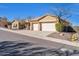 House exterior with a three-car garage and fire hydrant at 38724 N Donovan Ln, Anthem, AZ 85086