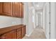 Hallway with built-in cabinets and wood flooring at 38724 N Donovan Ln, Anthem, AZ 85086