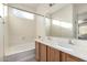 Bathroom with double vanity and large mirror at 3929 W Glacier Ct, Anthem, AZ 85086