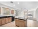 Kitchen with wood cabinets, granite countertops, and island at 3929 W Glacier Ct, Anthem, AZ 85086