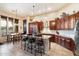 Gourmet kitchen with granite counters and island at 41912 N Club Pointe Dr, Anthem, AZ 85086