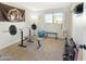 Home gym with weight bench, weights, and exercise ball at 4847 W Paradise Dr, Glendale, AZ 85304