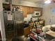 Galley kitchen with stainless steel appliances and wood cabinets at 5016 S 20Th Pl, Phoenix, AZ 85040
