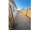 Side yard with a concrete slab and gated access at 5016 S 20Th Pl, Phoenix, AZ 85040