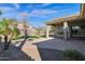 Covered patio and grassy backyard with artificial turf at 5026 W Parsons Rd, Phoenix, AZ 85083
