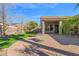 Artificial turf backyard with covered patio and palm trees at 5026 W Parsons Rd, Phoenix, AZ 85083