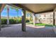 Covered patio overlooking a grassy backyard with palm trees at 5026 W Parsons Rd, Phoenix, AZ 85083