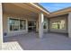 Spacious covered patio with brick pavers and access to the backyard at 5026 W Parsons Rd, Phoenix, AZ 85083