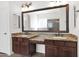 Bathroom boasts double sinks and a large vanity with granite countertop at 5026 W Parsons Rd, Phoenix, AZ 85083