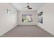 Bright bedroom with neutral carpeting and ceiling fan at 5026 W Parsons Rd, Phoenix, AZ 85083