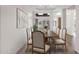 Formal dining room with wood table, seating for six, and lots of natural light at 5026 W Parsons Rd, Phoenix, AZ 85083