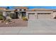 Single-story house with two-car garage, landscaping, and a stone facade at 5026 W Parsons Rd, Phoenix, AZ 85083