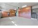 Large garage with ample storage cabinets and a punching bag at 5026 W Parsons Rd, Phoenix, AZ 85083