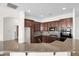 Well-equipped kitchen with dark wood cabinets and granite countertops at 5026 W Parsons Rd, Phoenix, AZ 85083