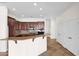 Modern kitchen featuring granite counters and dark wood cabinetry at 5026 W Parsons Rd, Phoenix, AZ 85083