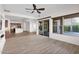 Living room with hardwood floors, sliding doors, and kitchen view at 5026 W Parsons Rd, Phoenix, AZ 85083