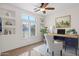 Cozy home office with a built-in desk, natural light, and modern décor at 5026 W Parsons Rd, Phoenix, AZ 85083