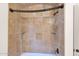 Shower stall with tile surround and built-in shelves at 5026 W Parsons Rd, Phoenix, AZ 85083