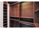 Well-organized walk-in closet with shelves and hanging rods at 5026 W Parsons Rd, Phoenix, AZ 85083