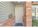 Front entrance with a decorative security door and brick columns at 5135 E Evergreen St # 1269, Mesa, AZ 85205