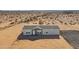 New manufactured home with a large desert lot and driveway at 53259 W Barn Owl Rd, Maricopa, AZ 85139