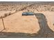 New manufactured home with a large desert lot and driveway at 53259 W Barn Owl Rd, Maricopa, AZ 85139